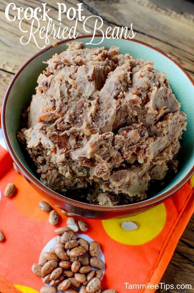 Super easy Homemade Crock Pot Refried Beans Recipe! Perfect for Mexican night, taco night, or burritos! This slow cooker recipe makes family dinners quick and easy to prepare!