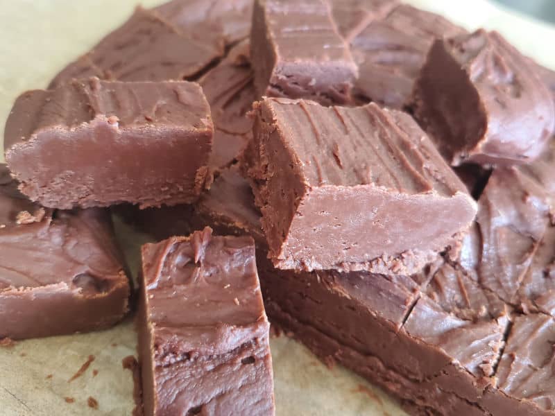 Pieces of Carnation Famous Fudge on parchment paper