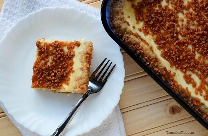 Creme Brulee bar on a white plate with a fork next to the baking dish