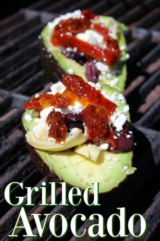 grilled avocados under two avocados with sundried tomatoes, feta, and kalamata olives 