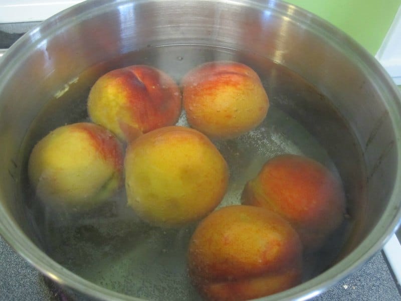 Peaches boiled in a pot