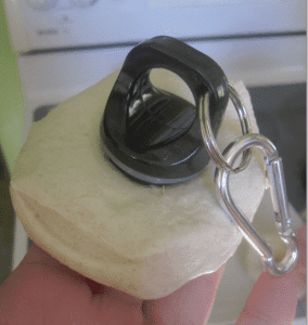 bottle top cutting a hole in a biscuit