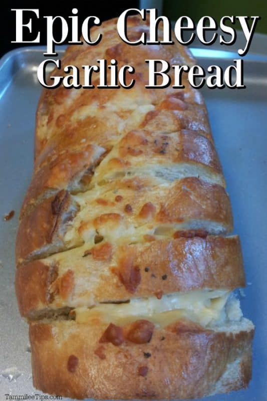 Epic cheesy garlic bread over slices of garlic bread on a baking sheet