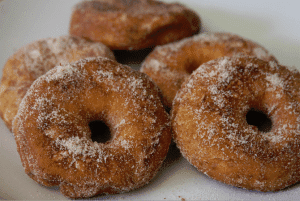 Plate of biscuit donuts with cinnamon and sugar
