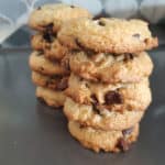 Cake Mix Chocolate Chip Cookies stacked on a baking sheet