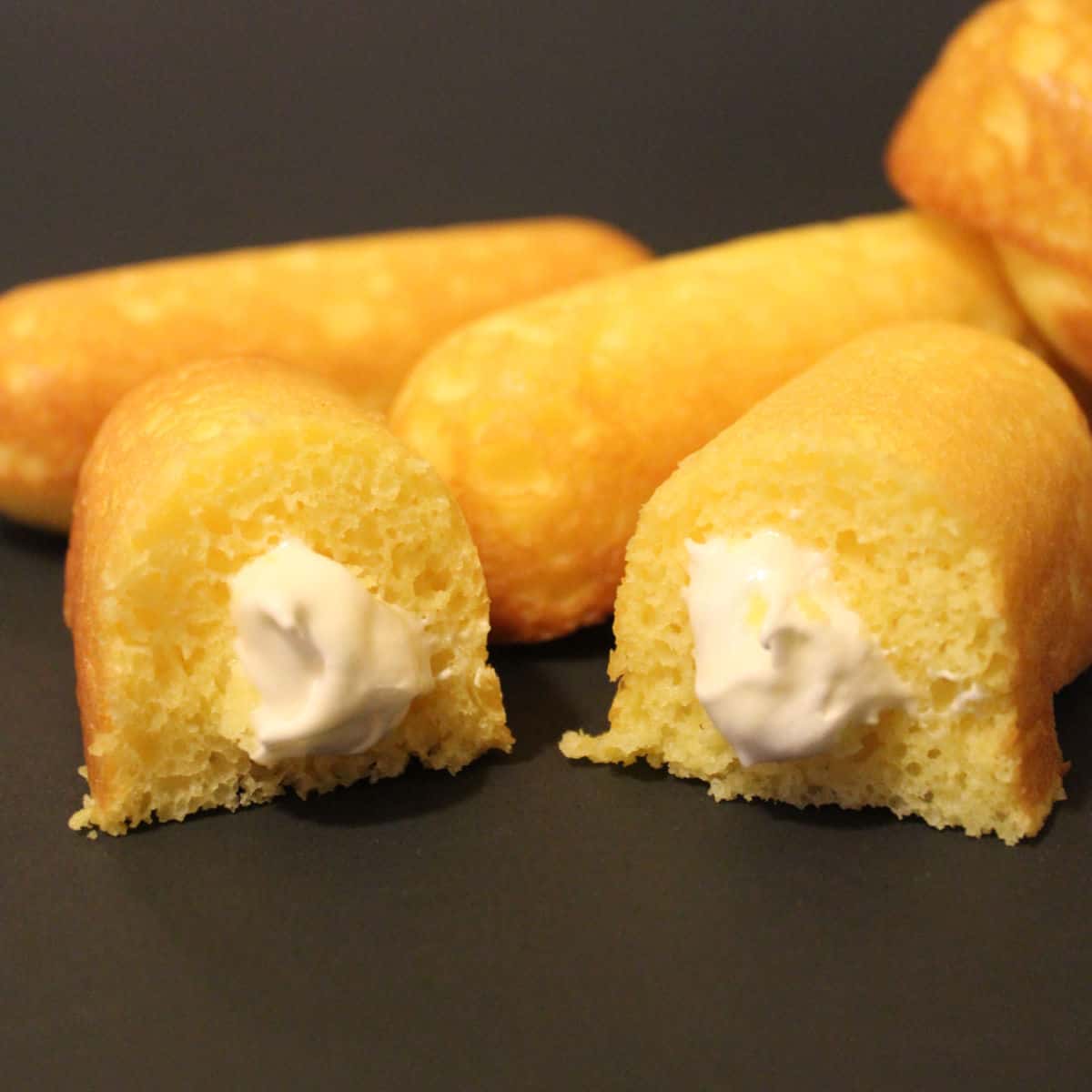 Homemade Twinkies on a black background