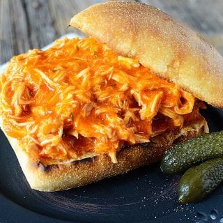 Simple Crock Pot Spicy Buffalo Ranch Chicken Sandwich Recipe! Only 3 ingredients needed to make this recipe. Perfect for Super Bowl or any day of the week. This easy slow cooker recipe is a family favorite!