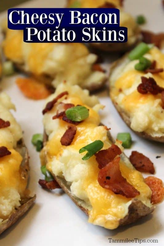 Cheesy Bacon Potato Skins text over a white platter with potato skins topped in cheese, bacon and green onion
