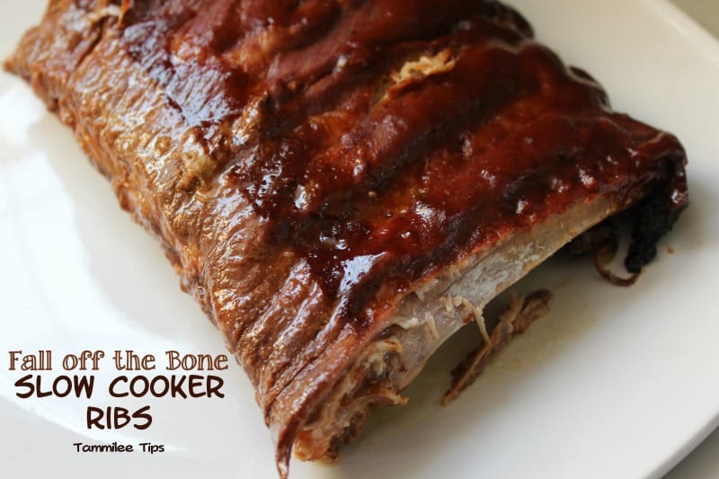 Fall off the bone slow cooker ribs next to a rack of ribs on a white plate