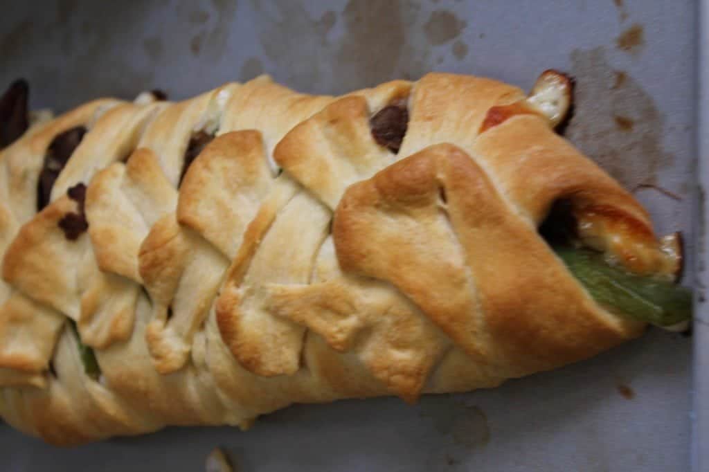 crescent roll braid baked on a baking sheet