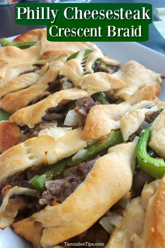 Philly Cheesesteak Crescent Braid over a white plate filled with cheesesteak 