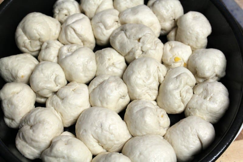 Biscuit dough balls in a circle baking dish