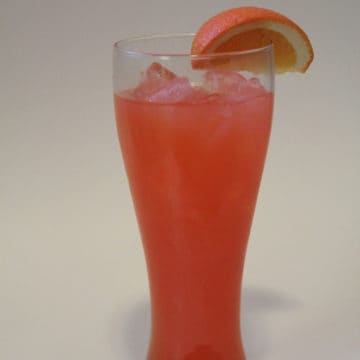 Chili's Calypso Cooler in a tall glass with an orange garnish