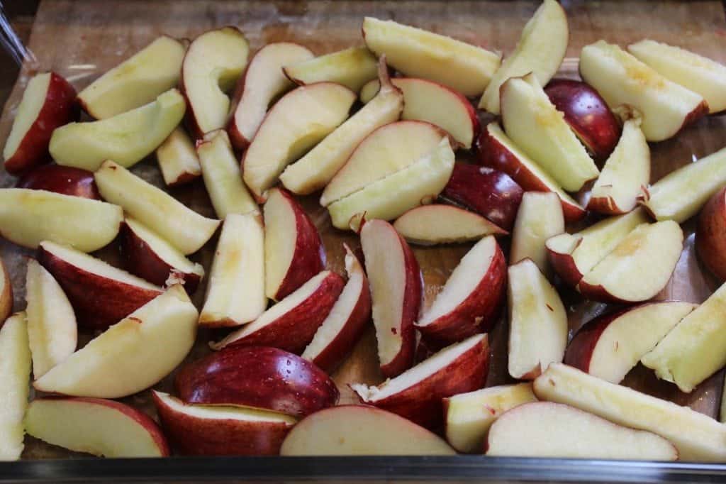 Sliced apples in a glass baking dish