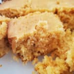 squares of crockpot cornbread on a white platter