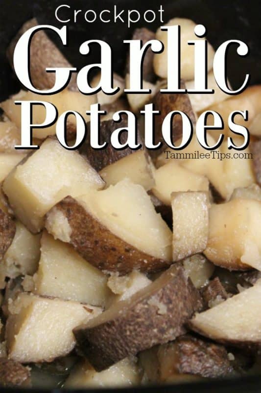 Crockpot Garlic Potatoes over potatoes in a slow cooker bowl