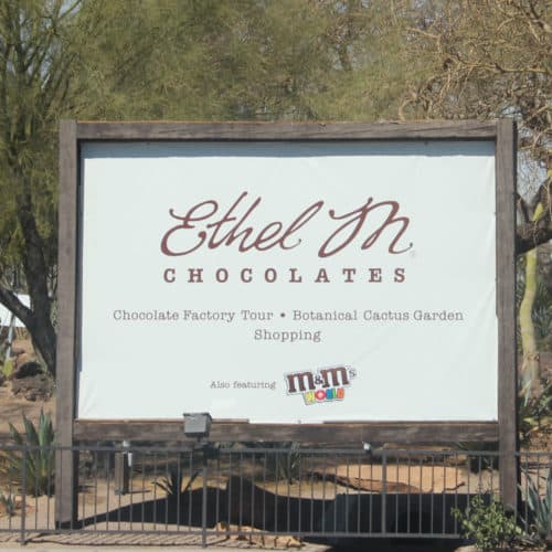 Ethel M Chocolates Sign with cactus in the background