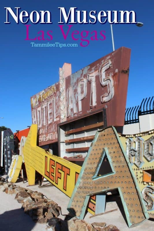 Neon Museum Las Vegas text over historic neon signs stacked next to each other 