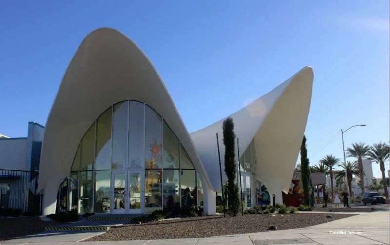 Exterior of curved building with lots of windows