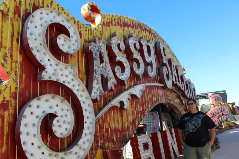 Sassy Neon Sign near other neon signs. 