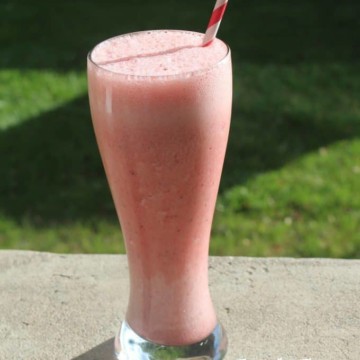 Copycat Orange Julius Strawberry Julius next to a tall glass with a pink drink