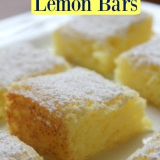 2 Ingredient Lemon Bars text over a white platter with lemon bars dusted in powdered sugar