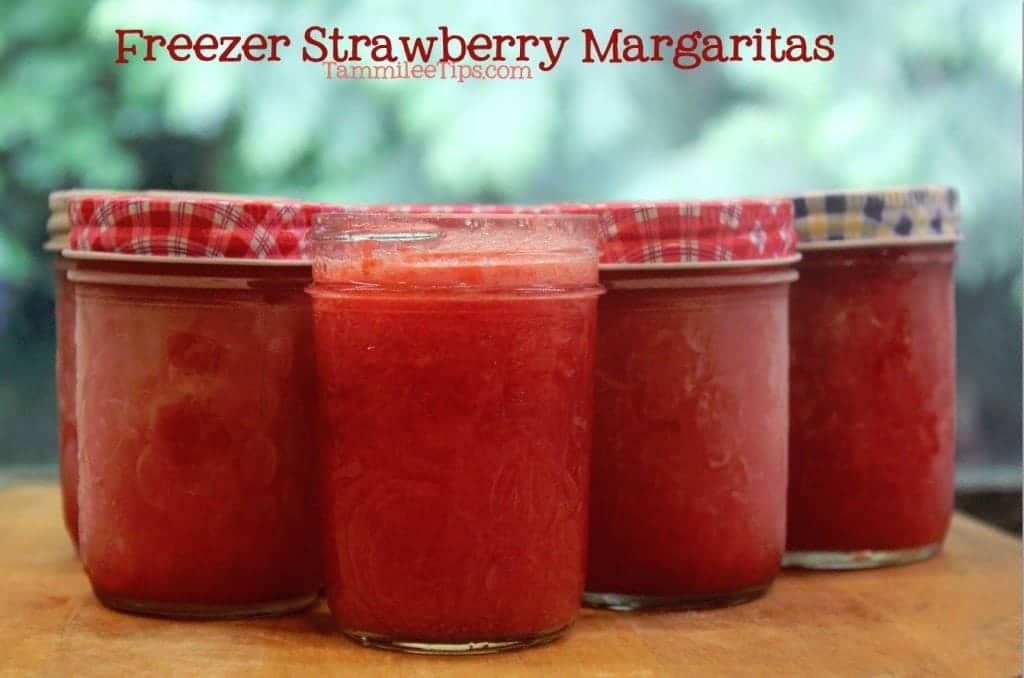 Freezer Strawberry Margaritas on a wooden cutting board