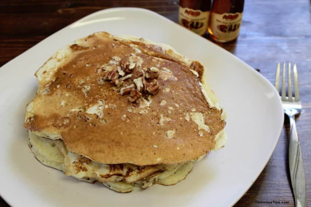 Copy Cat Cracker Barrel Pecan Pancakes on a white plate next to a fork