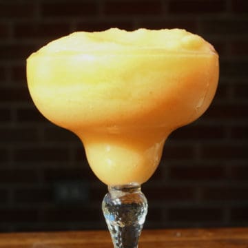 Frozen Peach Daiquiri in a margarita glass