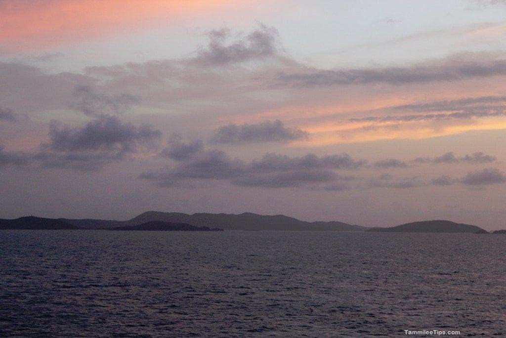 Carnival Breeze Balcony Sunset with clouds and islands in the distance