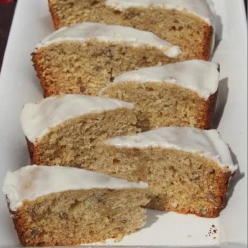 Crockpot Bourbon banana bread slices on a white platter