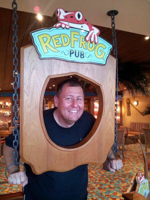 John smiling in a RedFrog Pub Sign