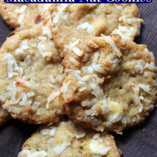Coconut macadamia nut cookies sitting on a brown paper napkin