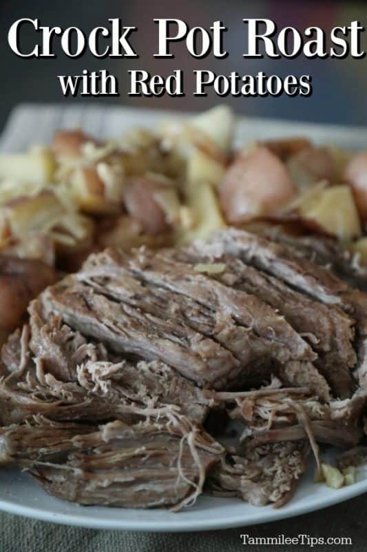 Crockpot roast with red potatoes over a platter with Alaskan amber roast and cut up potatoes
