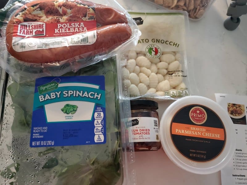 kielbasa, baby spinach, potato gnocchi, sundried tomatoes, and parmesan cheese