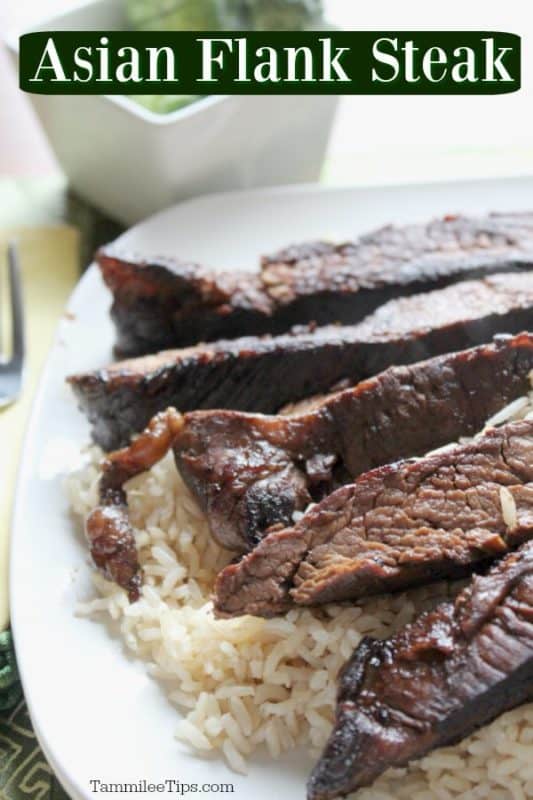 Asian flank steak over a white plate with steak strips and rice