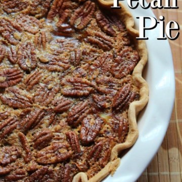 Pumpkin Pecan Pie text over a white pie dish with pecan pumpkin pie