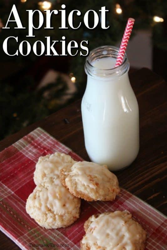 Apricot Cookies text over a wood board with cookies and a jar of milk 