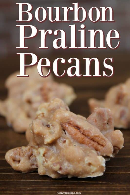 Bourbon Praline Pecans text over a dark board with pralines on it