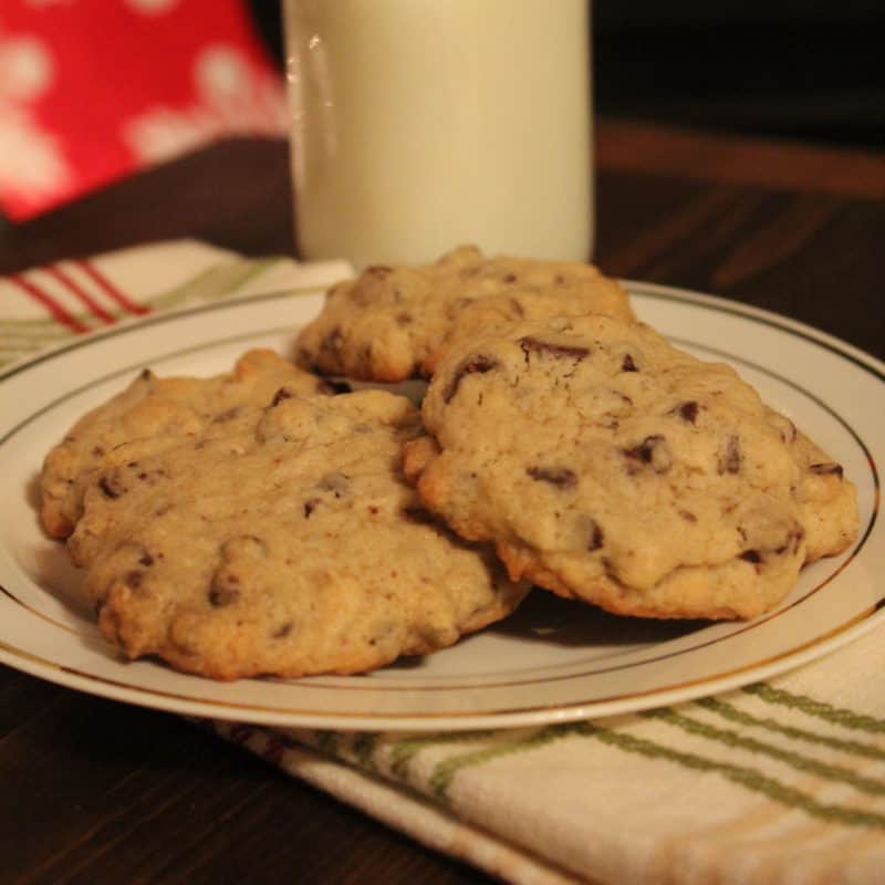 Chocolate Chip Coconut Rum Cookies on a white plate by a glass of milk