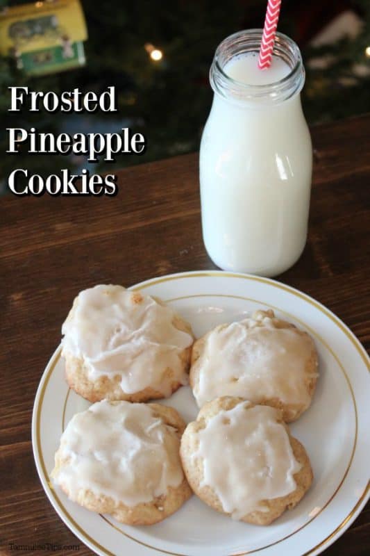 Frosted Pineapple Cookies text next to a white plate with cookies and a jar of milk with a red striped straw