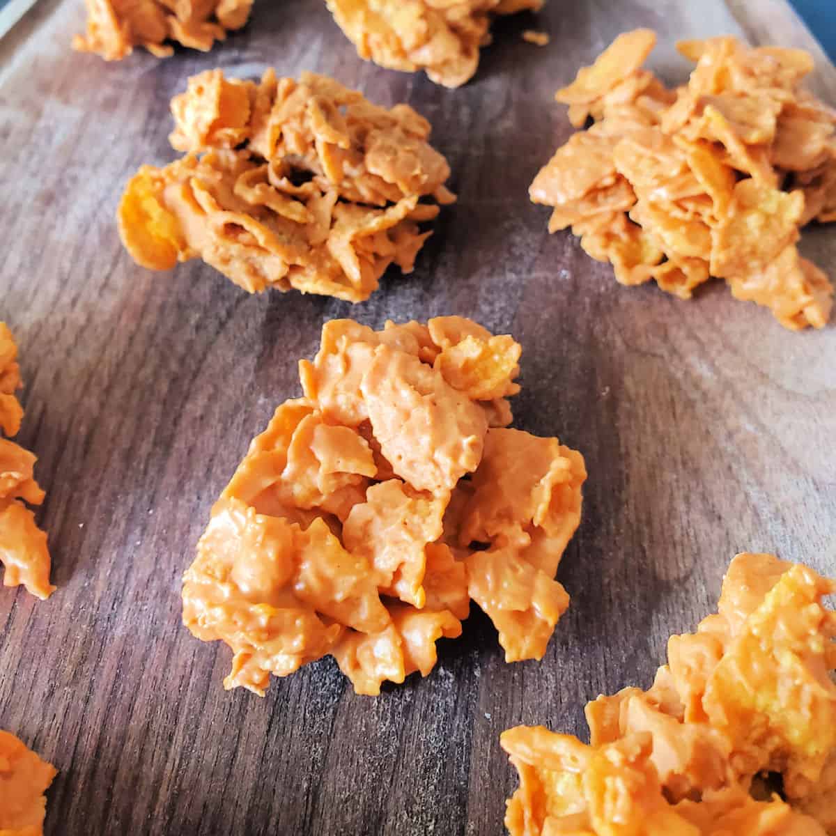 No Bake Butterscotch Cornflake Cookies on wood platter