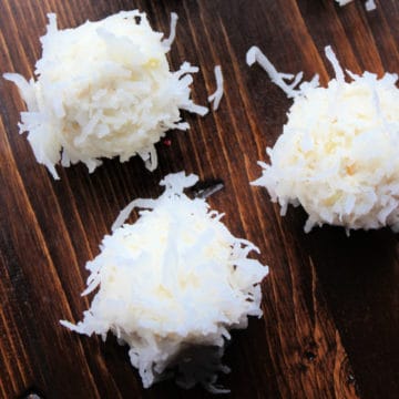 Tropical No Bake Truffles on a wood board