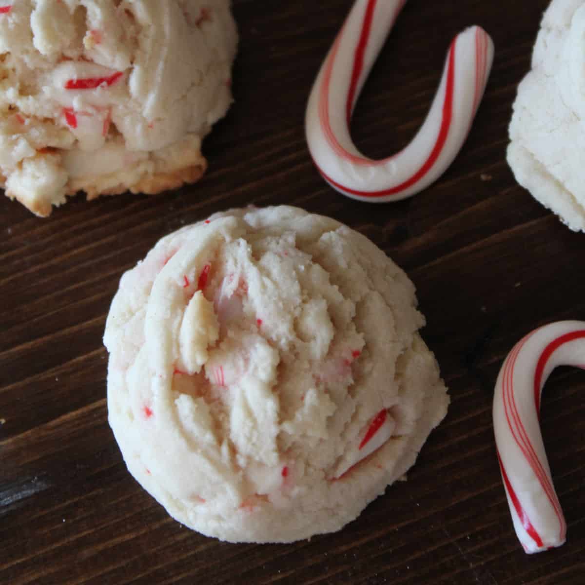 White Chocolate Candy Cane Cookies and candy canes on a wooden board