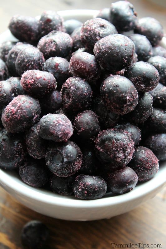 White bowl filled with frozen blueberries