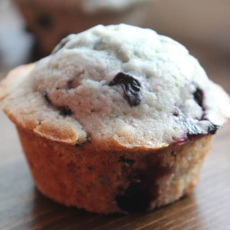 blueberry muffin on a wood board