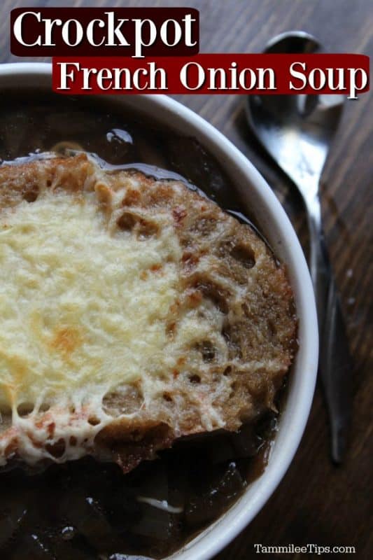 Crockpot French Onion Soup in a white bowl on a wood background with a silver spoon