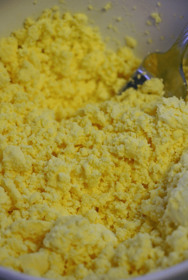 Egg yolks in a bowl mashed