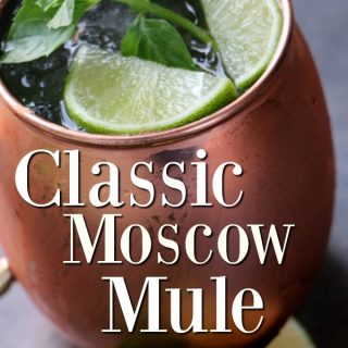 Classic Moscow Mule text over a copper mule mug with lime and mint