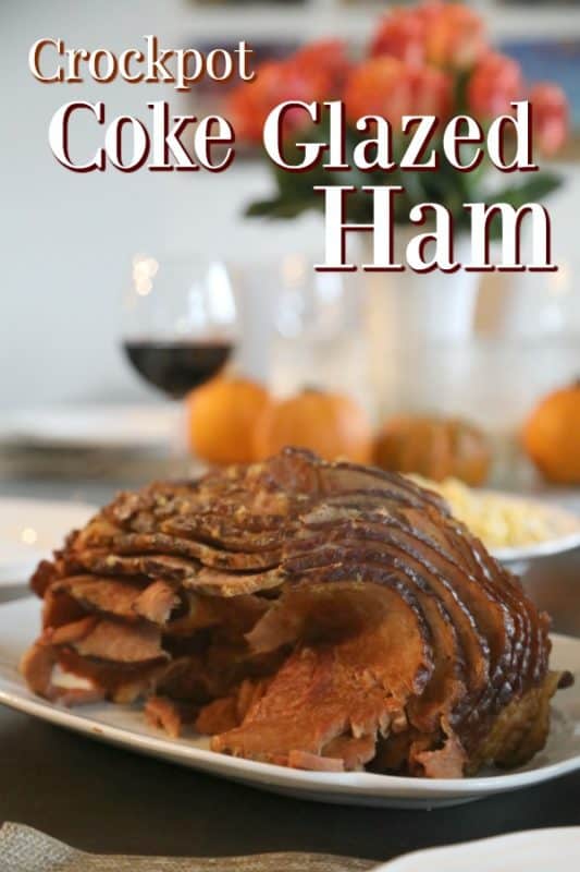 Crockpot Coke Glazed Ham over a spiral cut ham on a white platter